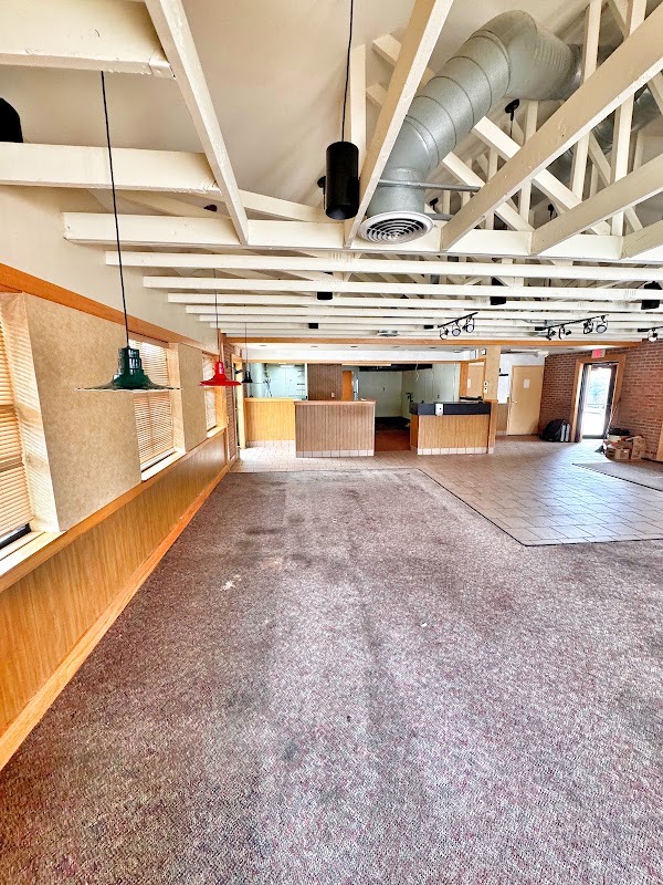 Pizza Hut interior in Manitowoc before demolition, with counters and floor coverings in place